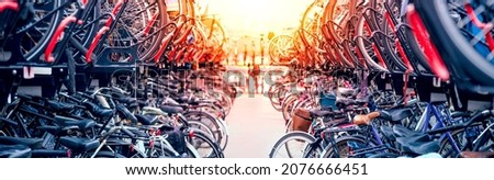 Large public city bike parking. Eco-friendly transport for a healthy life. Bicycle parking in Amsterdam, Holland. Panoramic view, large size