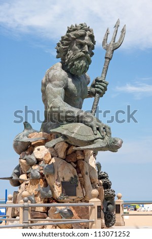 A large public statue of King Neptune  that welcomes all to VA beach in Virginia USA.