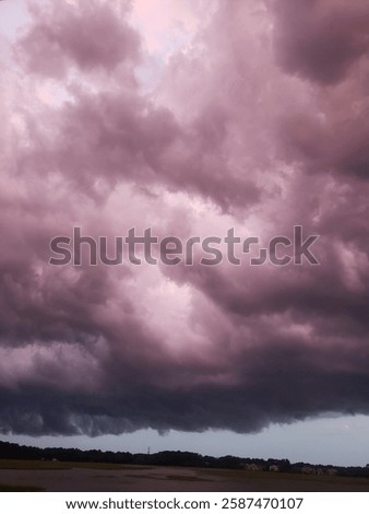 large purple clouds rolling in storm