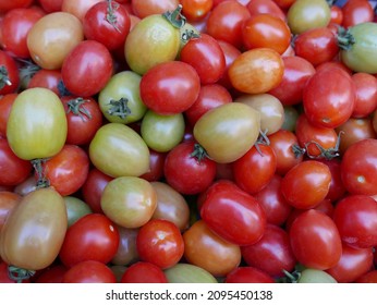 large quantity of green and red tomatoes at the market - Shutterstock ID 2095450138