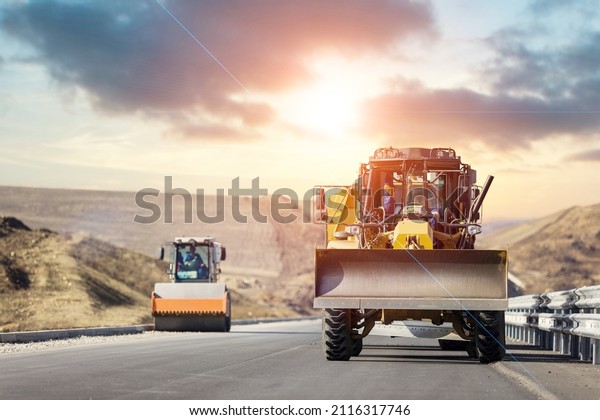 Large quarry dump truck. Big mining truck at\
work site. Loading coal into body\
truck.