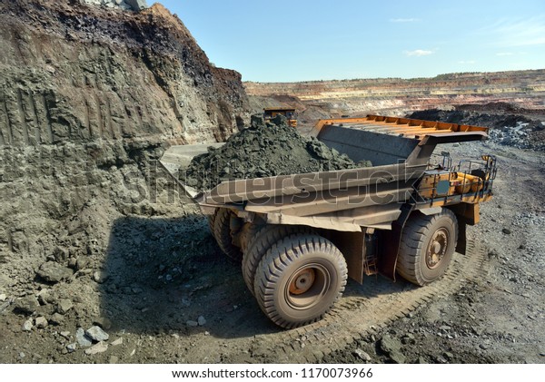 Large quarry dump truck. Loading the
rock in the dumper. Loading coal into body work truck. Mining truck
mining machinery, to transport coal from
open-pit