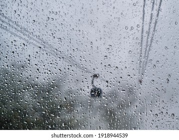 Large Raindrops On Glass In Focus, Window, Cable Car In Fog, One Phonikuler Blurred, Out Of Focus