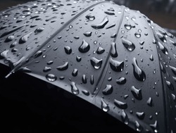 Large Raindrops On The Surface Of The Umbrella. Close Up