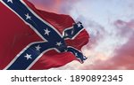 Large rebel flag waving in the wind . the Confederate battle or Dixie flag. Stars and Bars. Vintage United States flag