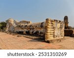 Large reclining Buddha statue in the temple complex of Wat Lokkayasutha in Ayutthaya