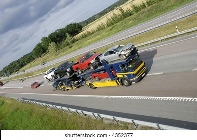 Large Recovery Truck For Towing Away Crashed Cars, Driving On Highway