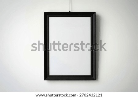a large rectangular black picture frame