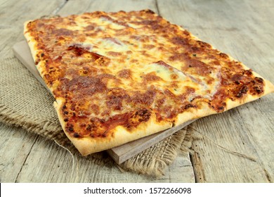 Large Rectangular Pizza Lying On A Table