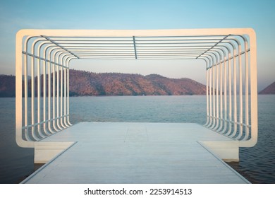 Large rectangular shape, photogenic view of the resort surrounded by mountains and water.