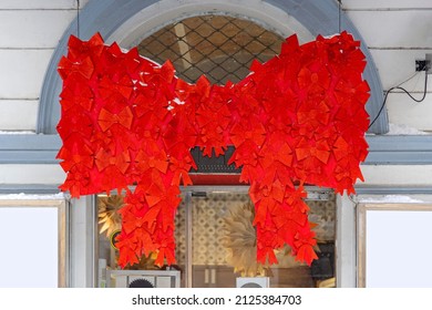 Large Red Bow Festive Decor At Building