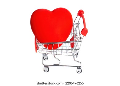 Large red heart placed in a miniature push cart isolated on white. Romantic Valentine's Day concept. - Shutterstock ID 2206496255