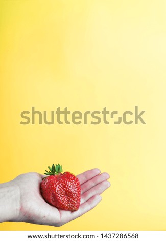 Similar – Woman holds strawberries in her hands