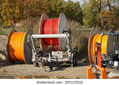 Large Reels Of New Fiber Optic Cable In Red And Orange, Expansion Of High-speed Internet In Rural Regions. Garbsen Berenbostel, Germany.                      