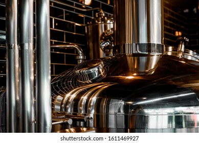 Large Reservoirs, Tanks And Pipes With Manometers In Private Microbrewery. Craft Beer Production Line. Industrial Interior Background.  View From Above.