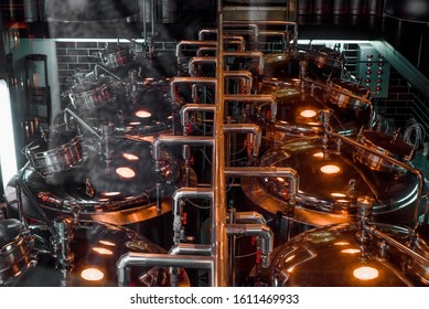 Large Reservoirs, Tanks And Pipes With Manometers In Private Microbrewery. Craft Beer Production Line. Industrial Interior Background.  View From Above.