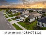 Large residential homes in southwest Florida gated community. American houses in rural US suburbs