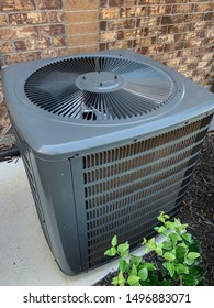 Large Residential HVAC Unit On A Concrete Slab For Apartments.