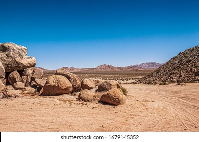 Large Rock Formation Along Offroad Trail In California Desert