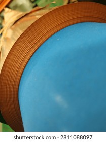 Large roll of copper foil viewed from the side, showing tightly wound layers and uniform metallic texture. Industrial raw material used in electronics and electrical manufacturing.