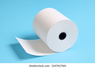 Large Roll Of White Paper Placed On A Blue Background.Blank White Paper Rolls Isolated.