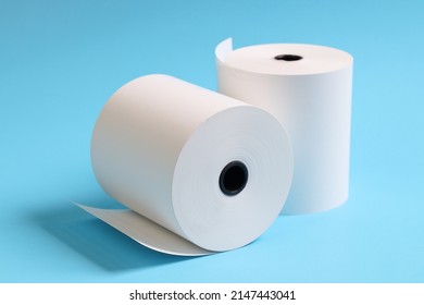 Large Roll Of White Paper Placed On A Blue Background.Blank White Paper Rolls Isolated.