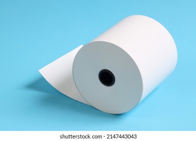 Large Roll Of White Paper Placed On A Blue Background.Blank White Paper Rolls Isolated.