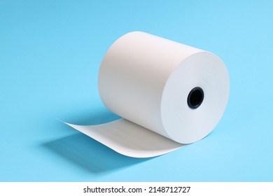 Large Roll Of White Paper Placed On A Blue Background.Blank White Paper Rolls Isolated.