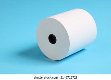 Large Roll Of White Paper Placed On A Blue Background.Blank White Paper Rolls Isolated.