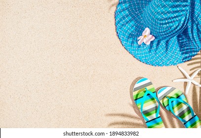 Large Round Blue Summer Hat And Colorful Stripy Sandals On Sand With Palm Tree Shadow, Tp View, Copy Space 