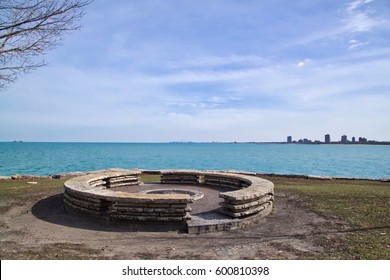 Large, Round Stone Fire Pit In Chicago City Park In Chicago's South Side With View Of Southern Skyline And Indiana