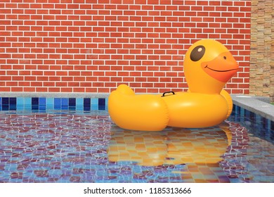 A Large Rubber Duck Floats In The Middle Of The Pond.