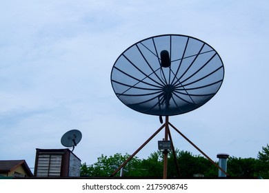 Large Satellite Dish On Blue Shy Day