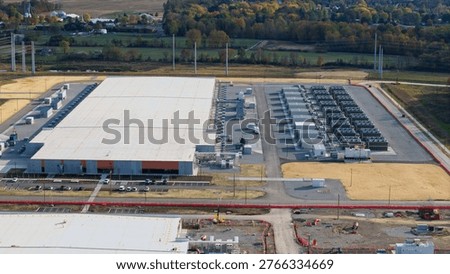 Large scale AI data center and server farm campus operating in rural landscape