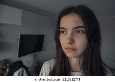 Large Scale Portrait Of Candid Teen Girl Looking At Window At Home Closeup View