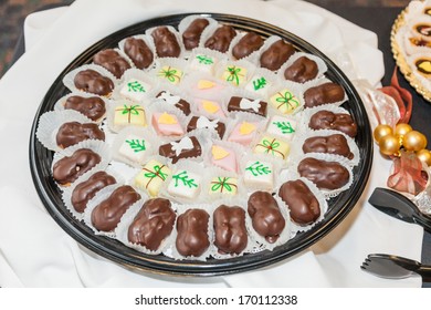 Large selection of assorted cookies on a plate.