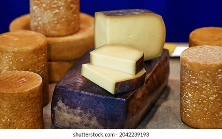 Large selection of cheeses on typical farmer market. Selective focus. High quality photo
