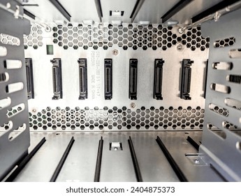 A large server which is empty, showing several peripheral ports.