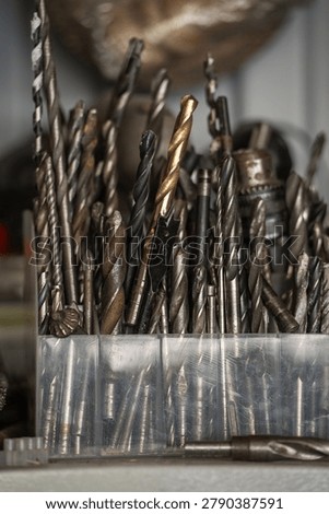 A large set of old drill bits in the workshop