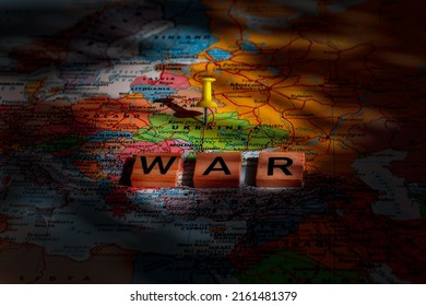 A Large Shadow On The Map Of Eastern Europe With The Word WAR. Geopolitical Concept