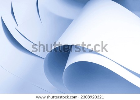 Large sheets of white paper in cold colors.