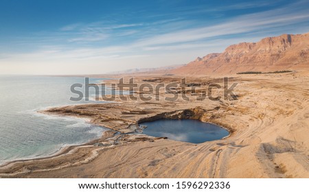 A large sinkhole along the Dead Sea shore line near Ein Gedi in southern Israel.