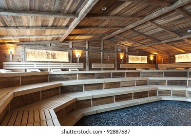 Large Sized  Sauna Made With Very Old Wood And Historical Ligthning Images With Frames At The Wall