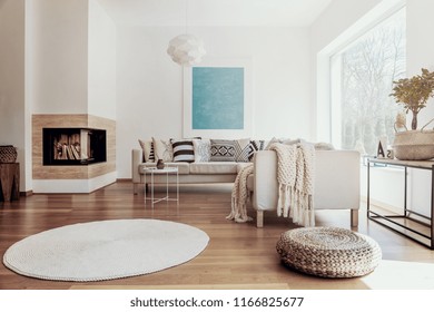 Large Sky Blue Abstract Art Poster And A Modern Fireplace In A Bright Living Room Interior With Dark Hardwood Floor