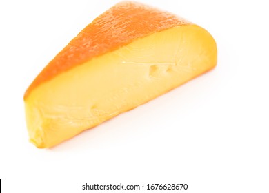 Large Slice Of Smoked Gouda Cheese On A White Background.