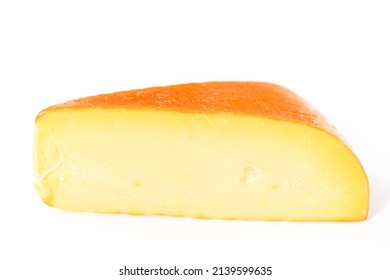 Large Slice Of Smoked Gouda Cheese On A White Background.