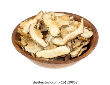 Large Sliced Dried Shitaki Mushrooms In Wooden Bowl Ready To Reconstitute For Your Favorite Recipes.