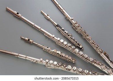 Large and small flutes are spread out on a gray surface  - Shutterstock ID 2085673315