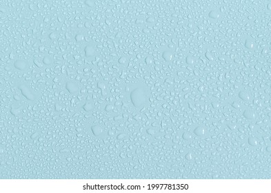 Large and small water drops on the blue background of the mine space. The texture of water drops is a close - up view from above. - Powered by Shutterstock