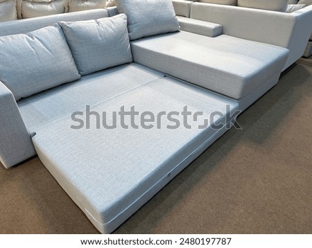 A large sofa with a function that can be converted into a bed.
